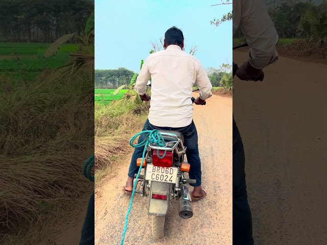 The boy has a rope tied to the back of his motorcycle #trending #shorts