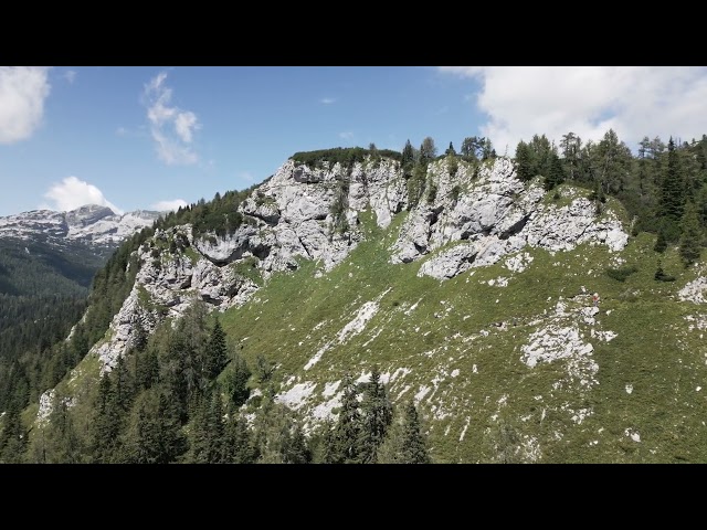 People hiking a small path on a big mountain with a view FREE STOCK VIDEO