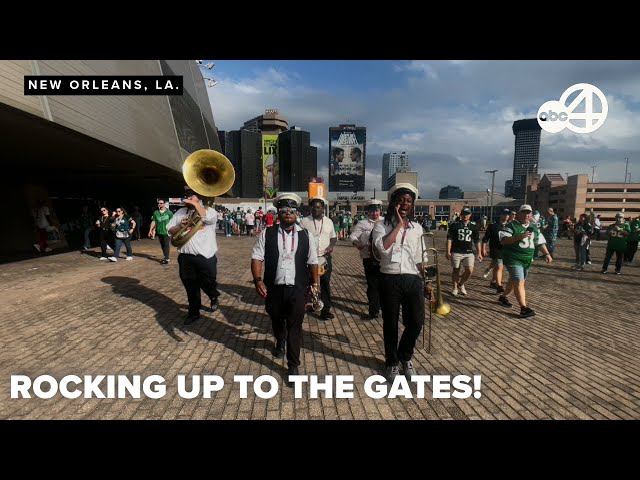 Local musicians serenade the incoming fans ahead of the big game