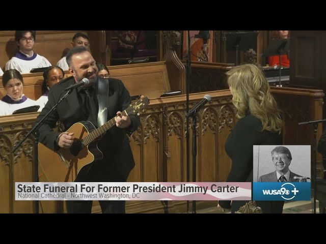 Garth Brooks performs 'Imagine' at President Carter's state funeral service