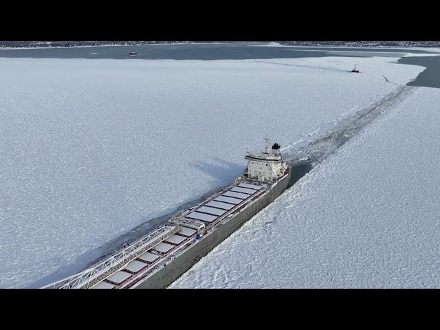 Freighter stuck in Lake Erie ice off Buffalo shoreline; Ice-breaking tug arrives to assist