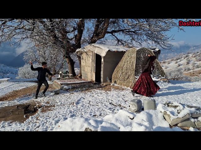 Blowing snow and playing in the snow with Mohammad and Leila and fetching firewood in the snow