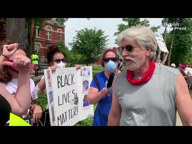 Man confronts protesters at Howell, Michigan rally