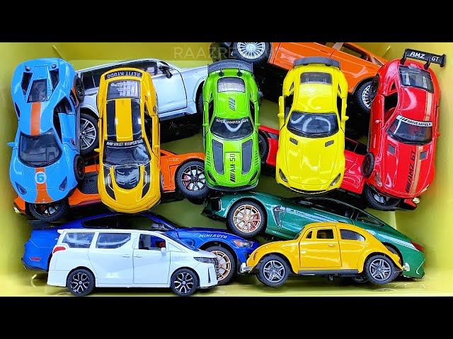 Box full of various miniature cars Peugeot, Volvo, Renault, Hyundai, Pagani, Cadillac One, DHL 13