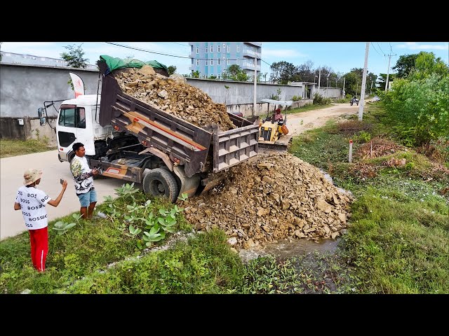 Good skill and nice filling technique dump trucks and bulldozer filling land