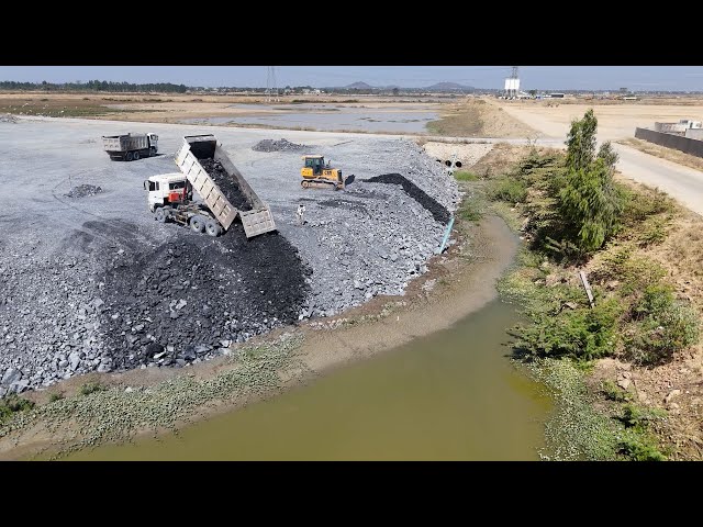 Working together Activity Filling Stone In the Floodplain Area with Bulldozer , Truck​ in Processing