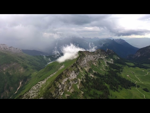 Cloud formation over a mountain ridge in the french alps FREE STOCK VIDEO