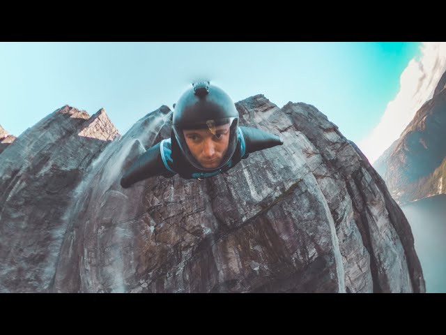 Wingsuit BASE jump over a waterfall | Immersive 360 VR