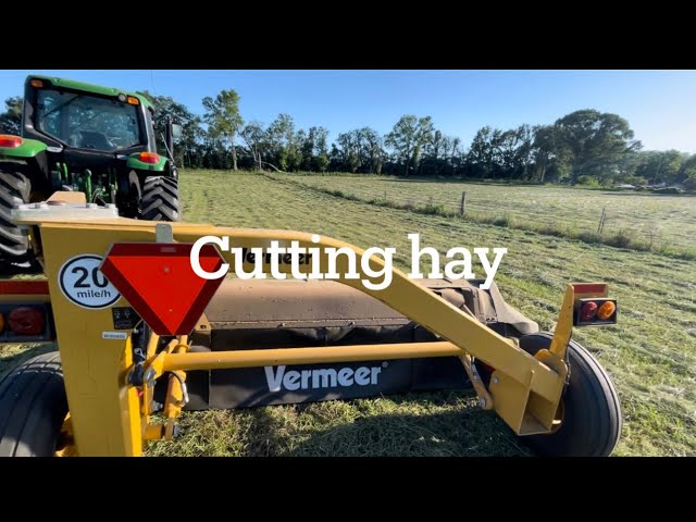 Cutting hay and spreading lime