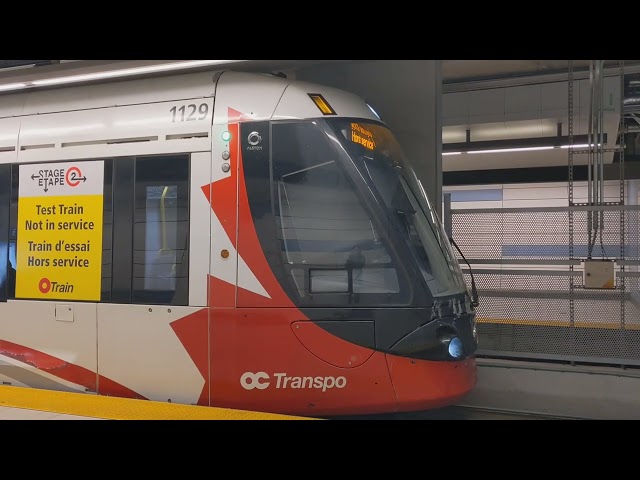 Otrain line 1 test train with bell departing Rideau station.