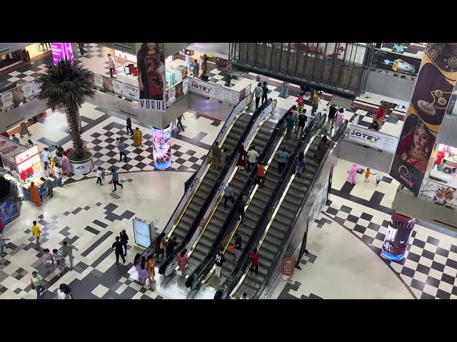 Moving People in City Shopping Complex | Royalty free stock footage - No copyright video | 4K