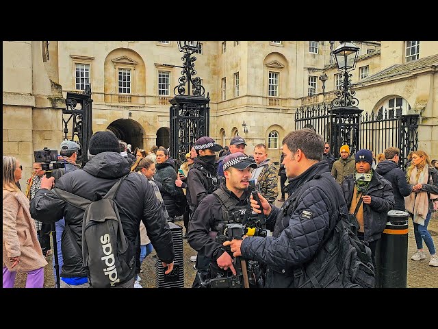 POLICE INTERVENE following fisticuffs at Horse Guards as The King's Guard looks bemused!