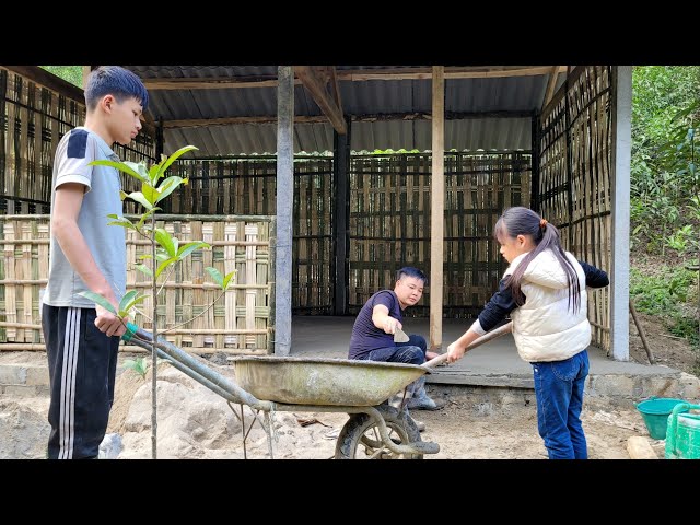 The two orphans' new home has cement floors.