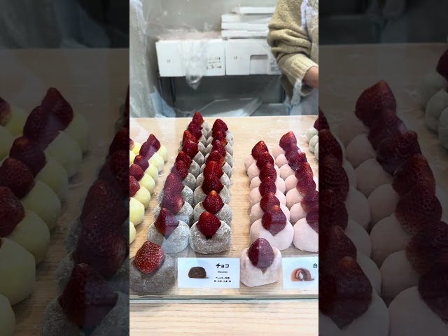 Discovering sweet perfection in every bite – Japanese strawberry mochi on display! 🍓