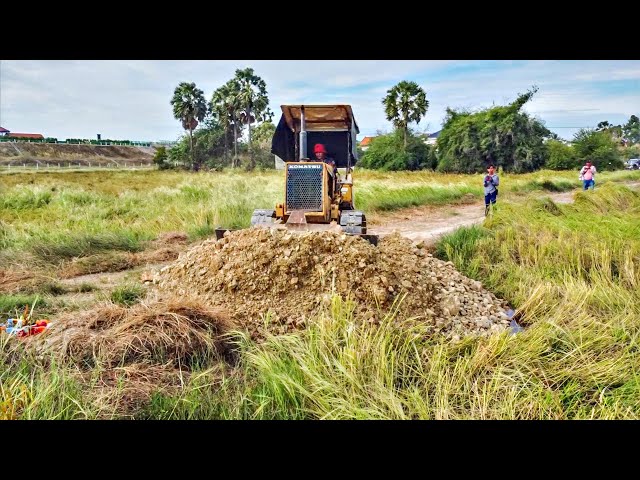 First Start A New project! Land filling on the field by Bulldozer Komat'su D20P with 5ton Trucks