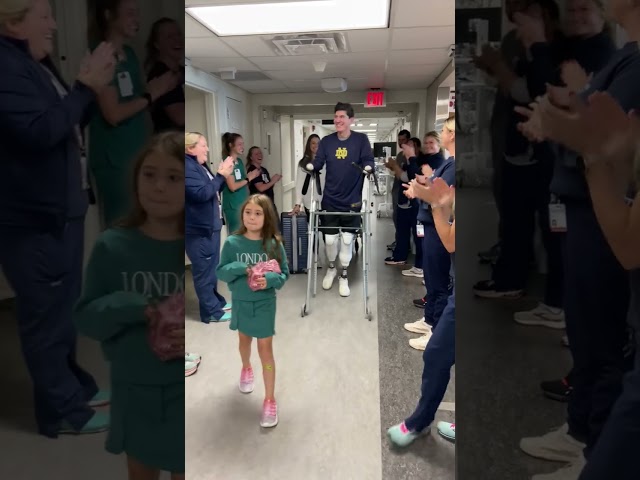 Quadruple amputee walks out of hospital to applause from caregivers | Ohio State Medical Center