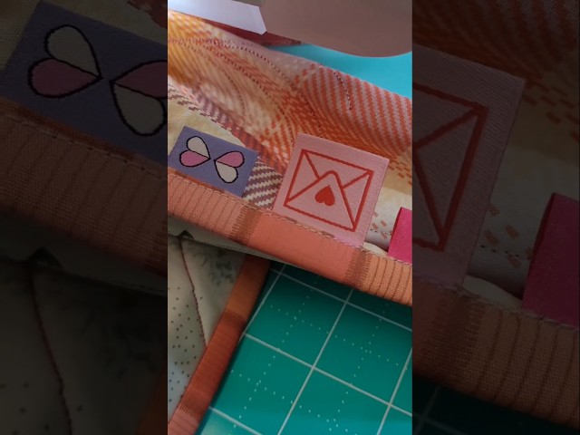 Add labels in quilt binding when sewing the binding on your quilt #quilt #binding #labels