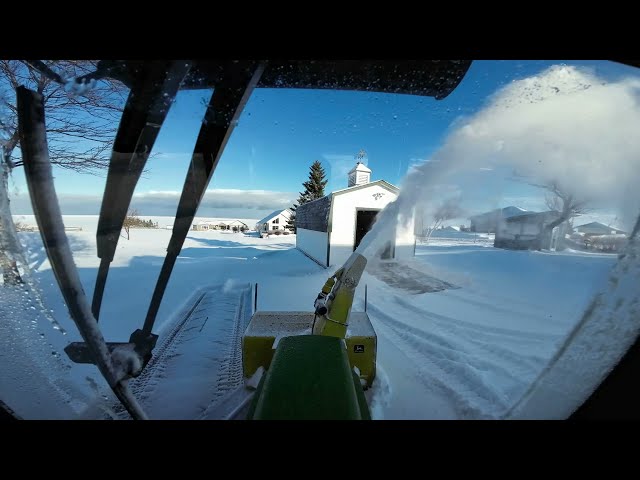 Early morning snowblowing action with the John Deere 322