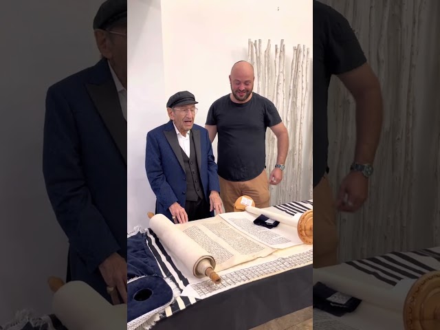 Holocaust Survivor 97 year old Saul Dreier writing a letter in the Torah!