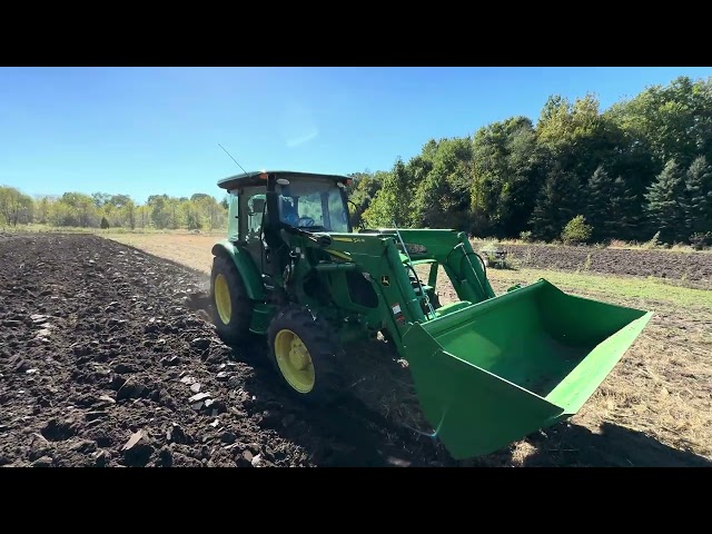 John Deere 5067E plowing with 3 bottom plow