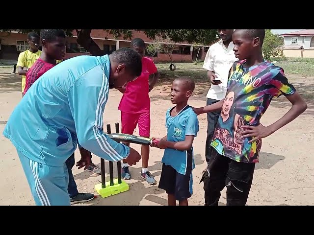 ICC Coach teaches newest and youngest cricketer timing on how to hit ball with bat