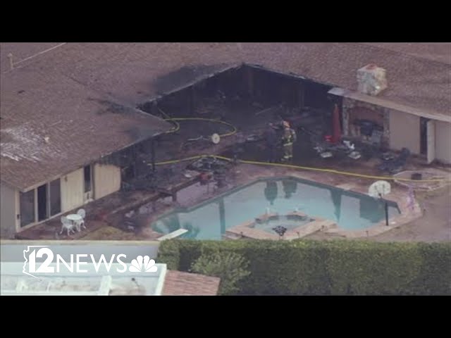 Man pulled from Phoenix house fire has died, officials say