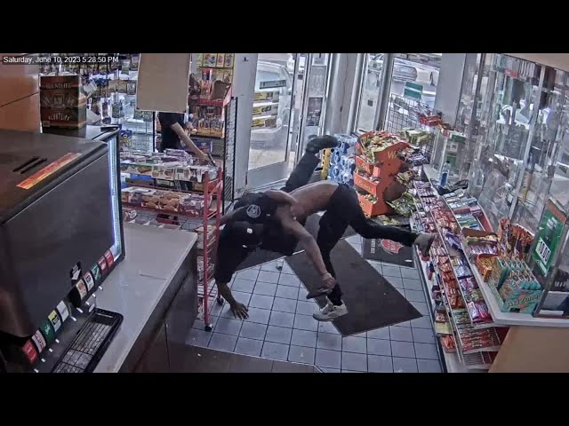 Surveillance video shows Detroit officer ambushed at gas station