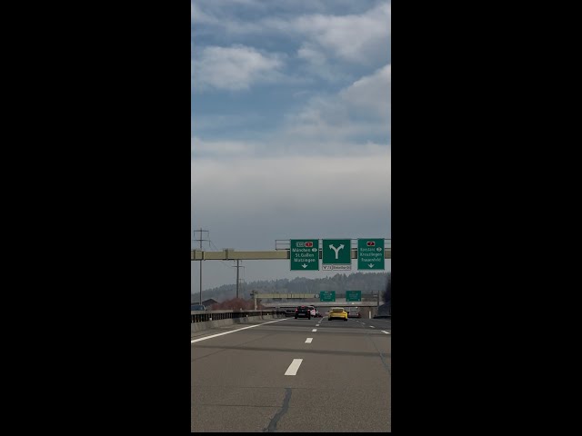 "Swiss Highway Surprise: Spotted a Yellow Porsche in Action!"