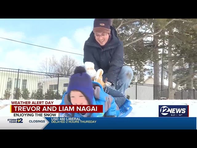 Students in Wichita enjoy snow day sledding in College Hill