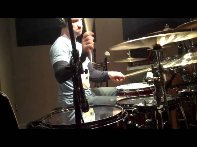 Matt Greiner using a GK Customs snare in the studio.