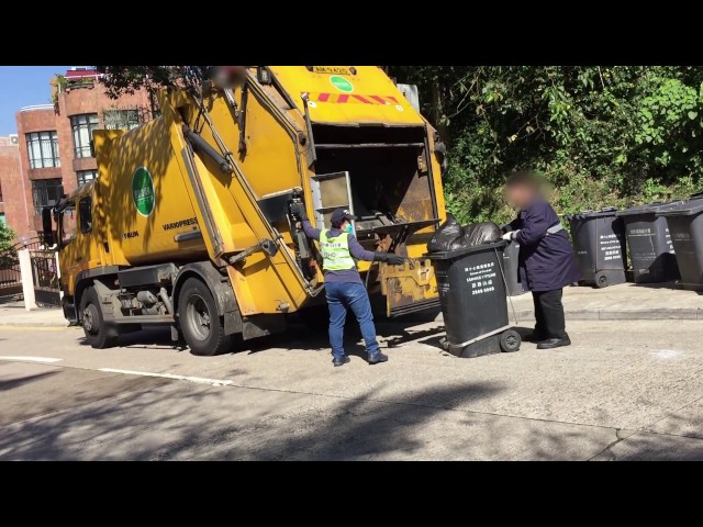 Rubbish/garbage/trash truck being loaded