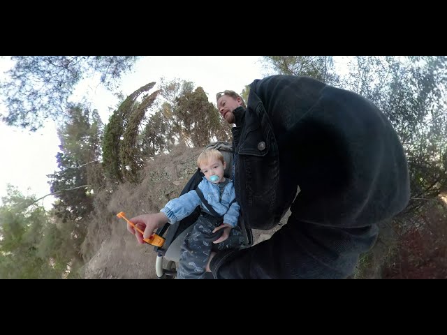 Travel adventures with my boy.My kid films in 360 as I carry him down a Barcelona mountain trail.