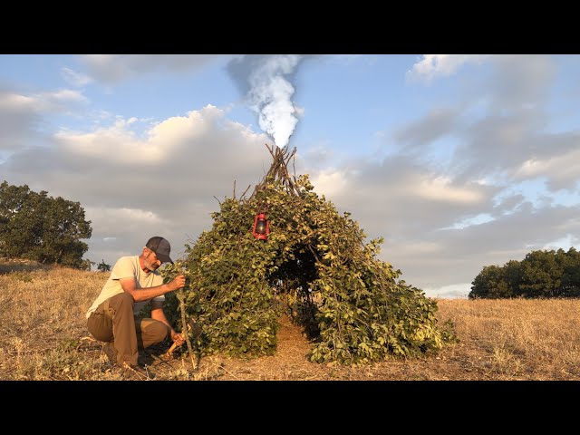 Survival bunker with stone fireplace. Cooking meat on stone. Roasted Corn. Fish on the angry rock