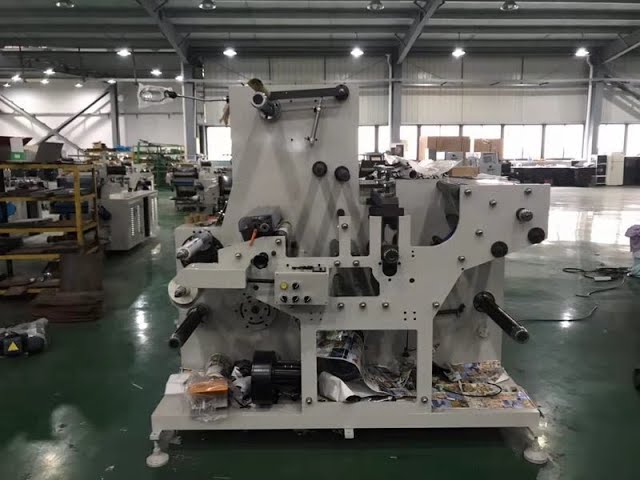 Rotary die cutting and slitting machine for blank label