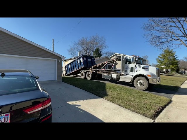 2 Roll Off Garbage Trucks