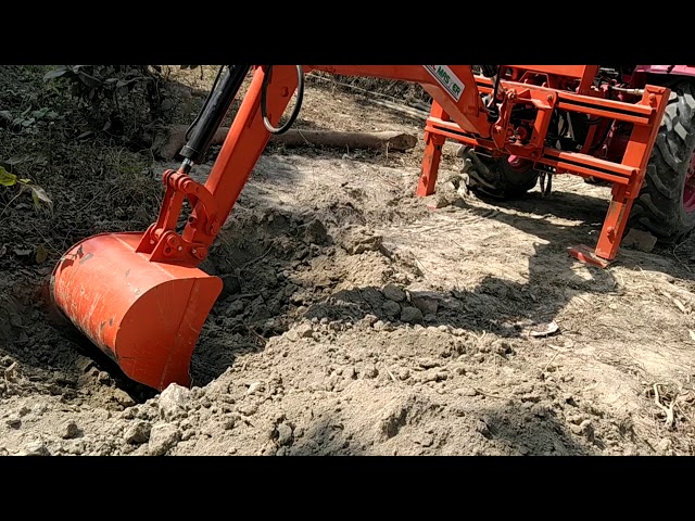 Tractor attached backhoe and louder Soil master