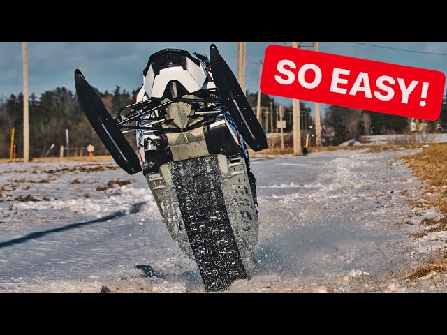 How To WHEELIE A SNOWMOBILE!