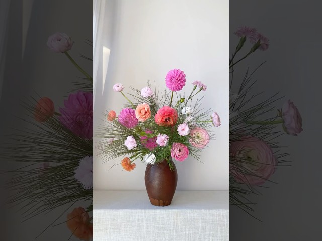 Simple flower arrangement with pine branch and few dahlias, peonies. #flowerarrangementideas