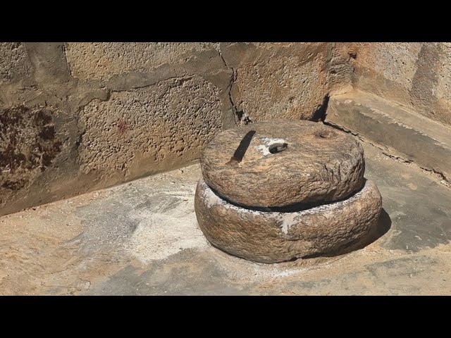 Grinding Corn.  मकै पिन्ने। Pahari Language of Nepal. पहरी भाषामा छ।