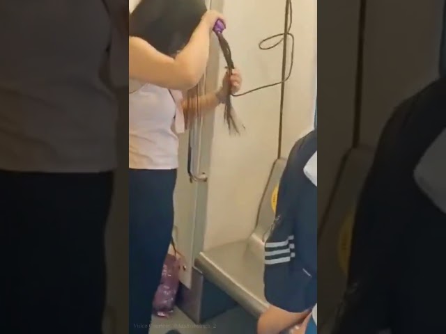 Woman Straightens Hair In Delhi Metro, WATCH | #Shorts | Viral Trending Video | News18 English