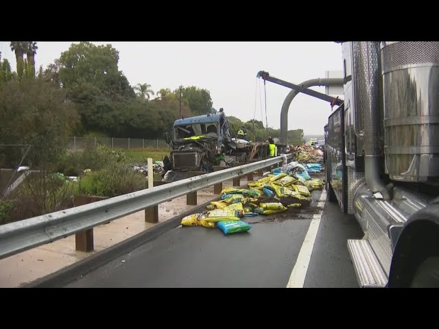 Semi-truck carrying fertilizer overturns on freeway as much-needed rain hits San Diego