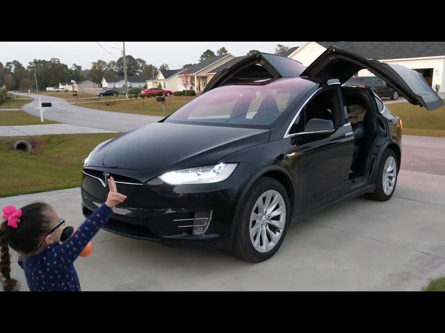 My 5yr old GrandDaughter Zoe watching the Tesla Model X Holiday Light Show!