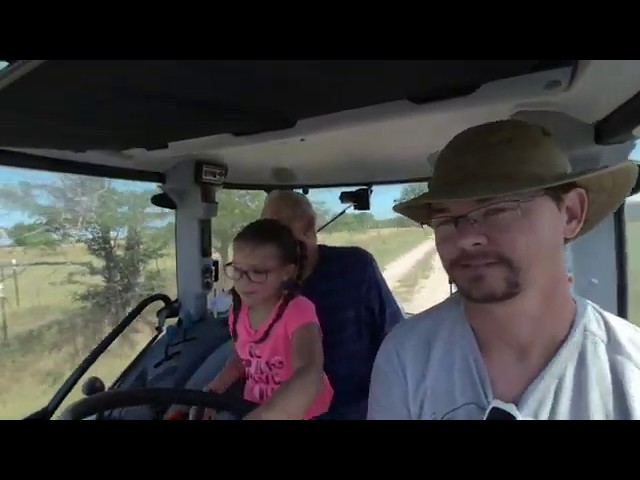 Twins having fun with a tractor