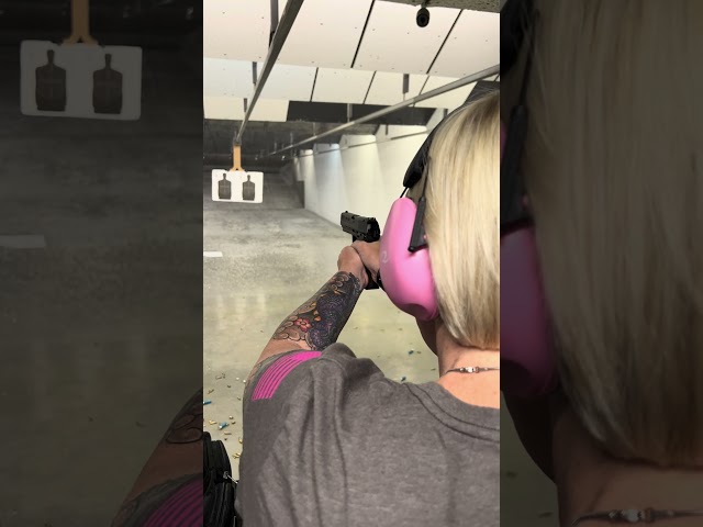 Wife at the range with a new purchase.