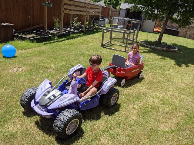 Kids use a Power wheels to create their own tractor pull, join them in vr180