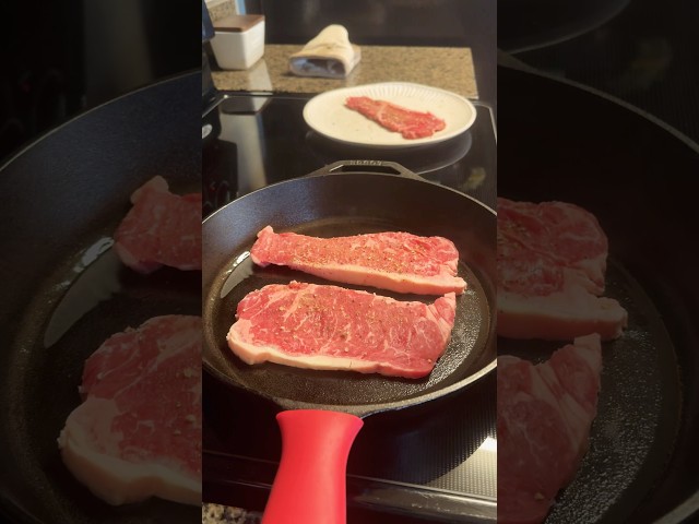 Searing steaks on a cast iron.  #steak #cooking #shorts