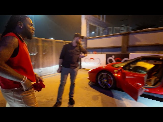 Burna Boy Drives His Ferrari 488 Spider With Heavy Presidential Security While Leaving DNA Gaza