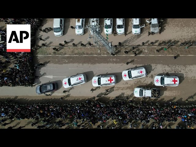 Drone footage shows release of three Israeli hostages in central Gaza