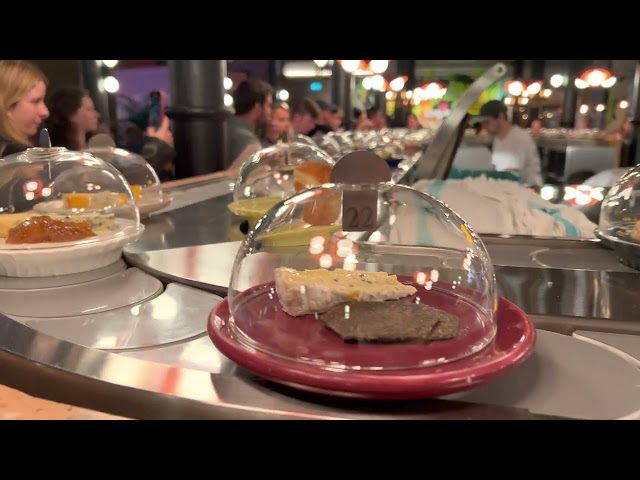 Picking a Rachel plate off the Pick & Cheese conveyor belt