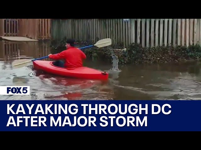 DC resident kayaks in flooded alley after storm